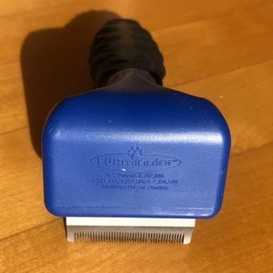 - Furminator cat grooming tool